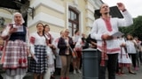 BELARUS -- People sing as they attend an opposition demonstration to protest against presidential election results in front of the Janka Kupala National Academic Theatre, in Minsk, August 20, 2020