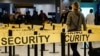 U.S. -- Passengers make their way through a security checkpoint at JFK International Airport in New York in this file photo taken October 11, 2014. 