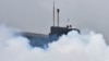 RUSSIA -- SEVEROMORSK, RUSSIA – AUGUST 11, 2016: A a radiological, chemical and biological defence unit takes part in a military drill to create smoke screens to conceal Russian Northern Fleet submarines.